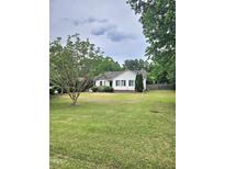 Charming single story home with a spacious lawn and mature shade trees at 1360 Honeycutt Rd, Willow Springs, NC 27592