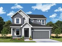 Charming two-story home with a gray exterior, white trim, and a two-car garage in a well-manicured community at 62 Restful Point, Fuquay Varina, NC 27526
