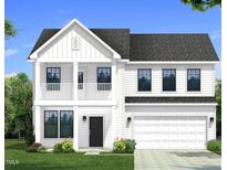 New two-story home featuring a covered porch and a two-car garage at 682 Old Station Pointe, Angier, NC 27501