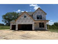 Unfinished two-story home with a two-car garage awaiting new construction to be completed at 209 Atkins Rd, Cameron, NC 28326