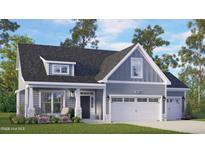 Charming home featuring a welcoming front porch, well-manicured lawn, and a convenient two-car garage at 235 Atkins Rd, Cameron, NC 28326