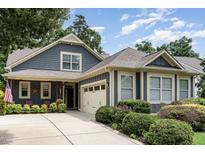 Charming home featuring a two-car garage, well-maintained landscaping, and inviting curb appeal at 241 Serenity Hill Circle Cir, Chapel Hill, NC 27516