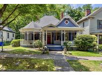 Charming Victorian home with a wrap-around porch and well-maintained landscaping at 517 N East St, Raleigh, NC 27604
