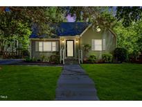 Charming single-story home featuring a manicured lawn and inviting front entrance at 1304 N Duke St, Durham, NC 27701