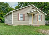 Charming single-story home featuring a cozy front porch and traditional siding at 1416 Betz St, Rocky Mount, NC 27803