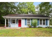 Charming single-story home with blue siding, a red front door and well-maintained lawn at 2 Capri Ter, Durham, NC 27703