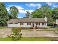 Charming single-story home with a well-maintained front yard and attached garage at 3620 Constellation Dr, Raleigh, NC 27604