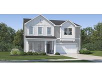 Charming two-story home with gray and white siding, stone accents, and a well-manicured lawn at 544 Morning Light Dr, Angier, NC 27501