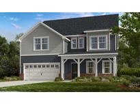 Charming two-story home featuring gray siding, a covered porch, and a two-car garage at 925 Kinglet House Rd, Knightdale, NC 27545