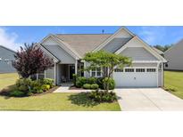 Charming single Gathering home showcasing manicured lawn and a two-car garage at 1112 Monterey Bay Dr, Wake Forest, NC 27587
