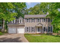 Charming two-story home with a two-car garage and well-maintained landscaping in a treed lot at 203 N Becket St, Cary, NC 27513