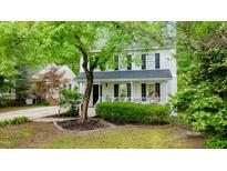 Charming two-story home with a inviting front porch and mature landscaping, offering a warm and welcoming curb appeal at 3541 E Jameson Rd, Raleigh, NC 27604