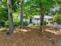 Charming single-story home with beautiful landscaping and mature trees in a desirable neighborhood at 4112 Rowan St, Raleigh, NC 27609