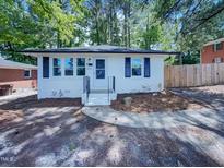 Charming single-story home with a freshly painted exterior and manicured front yard at 600 Cecil St, Durham, NC 27707