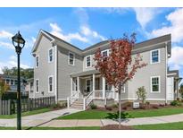 Charming two-story home with a welcoming front porch and well-manicured lawn at 1029 Whitehall Cir, Durham, NC 27713