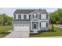Two-story home featuring gray siding, black shutters, and a two-car garage at 1541 Ivy Meadow Ln, Zebulon, NC 27597