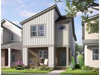 Charming two-story home with brick porch, white siding, and modern architectural details at 330 Cottage Hill Way, Knightdale, NC 27604