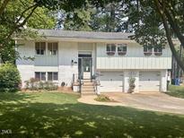Charming two-story home featuring an attached two-car garage and well-maintained lawn at 3620 Arrowwood Dr, Raleigh, NC 27604
