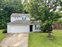 Charming two-story home with a well-manicured front yard and a two-car garage at 5911 Endsley Ct, Raleigh, NC 27610