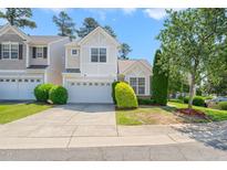 Charming two-story home with a well-manicured lawn and attached two-car garage, perfect for a Gathering at 107 Meeting Hall Dr, Morrisville, NC 27560