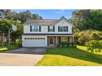 Charming two-story home features a well-maintained lawn, brick accents, and an attached two-car garage at 118 Brandi Dr, Rolesville, NC 27571