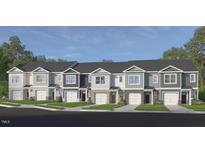 Charming townhome exteriors showcase varied neutral siding, attached garages, and well-manicured lawns, enhancing curb appeal at 5219 Red Crimson Dr, Willow Springs, NC 27592