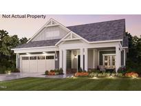 Charming single-story home featuring manicured landscaping and a welcoming front porch at 1205 Bridgeforth Ln, Chapel Hill, NC 27517
