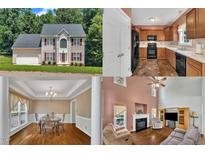 Charming two-story home featuring a symmetrical facade, complemented by red shutters and a well-maintained front yard at 1325 Red Brick Rd, Garner, NC 27529