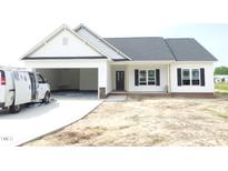 Charming single-story home featuring an attached garage, and classic curb appeal at 614 Tart Town Rd, Dunn, NC 28334