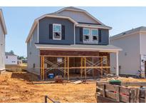 Two story home with blue and grey siding in the process of being completed at 837 Ottawa Dr, Garner, NC 27529