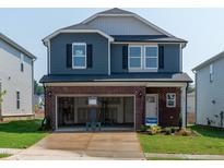 Charming two-story home featuring a spacious two-car garage and well-manicured lawn at 837 Ottawa Dr, Garner, NC 27529
