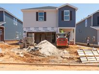 Image of a two-story home under construction, revealing its architectural framework and building materials at 841 Ottawa Dr, Garner, NC 27529