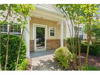 Inviting front entrance with stone accents and well-maintained landscaping at 1003 Crimson Dr, Durham, NC 27713