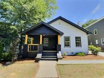 Charming renovated home with a covered porch and yellow posts at 114 N Guthrie Ave, Durham, NC 27703