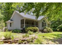Charming single-story home with a screened porch and lush landscaping at 2805 Evans St, Durham, NC 27705