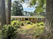 Charming single-story home with well-maintained landscaping and inviting curb appeal at 3716 Rivermont Rd, Durham, NC 27712