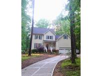Charming two-story home with a well-manicured lawn and inviting entrance, complete with a two car garage at 5917 Clearsprings Dr, Wake Forest, NC 27587