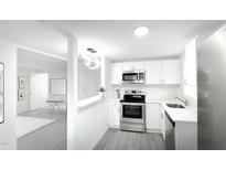 Bright kitchen with stainless steel appliances and modern white cabinetry at 800 Pritchard Avenue Ext # H3, Chapel Hill, NC 27516