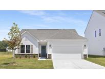 Charming single-Gathering home with a gray roof, well-manicured lawn, and a two-car garage at 94 Mable Court # 16, Lillington, NC 27546