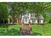 Charming two-story home features an attractive front entrance and lush landscaped yard at 108 Hotelling Ct, Chapel Hill, NC 27514