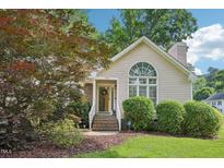 Charming single-story home featuring a landscaped front yard and large front window for natural light at 1102 Laurens Way, Knightdale, NC 27545