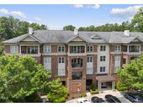 Beautiful brick condo building showcasing an attractive facade and well-maintained landscaping at 340 Allister Dr # 301, Raleigh, NC 27609