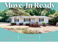 Charming single-story home featuring a front porch, landscaped yard, and classic design at 4509 Stevens Chapel Rd, Smithfield, NC 27577