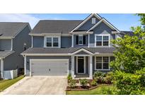 Charming two-story home with a two car garage and beautiful landscaping at 6624 Vestal St, Wake Forest, NC 27587