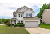 Charming two-story home with attached two car garage, landscaped yard and pleasing curb appeal at 1514 Hinchliff Ct, Fuquay Varina, NC 27526