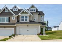 Attractive two-story home featuring a two-car garage, well-maintained landscaping, and inviting curb appeal at 228 Shingle Oak Rd, Wake Forest, NC 27587