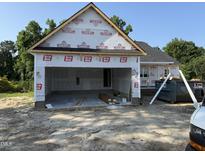 Spacious garage with concrete floor, ready for customization and ample storage at 2776 Rains Mill Rd, Princeton, NC 27569