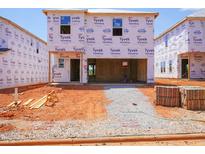 New construction shows the home's exterior framing wrapped in branded weather-resistant material at 832 Ottawa Dr, Garner, NC 27529