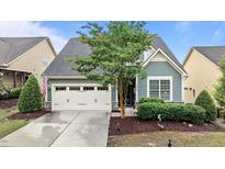 Charming home featuring a two-car garage, manicured landscaping, and lovely curb appeal at 1012 Autumn Meadow Ln, Wake Forest, NC 27587
