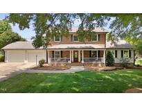 Charming brick home with a welcoming front porch and well-manicured lawn at 2127 Somers Ave, Burlington, NC 27215